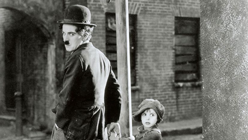 查理·卓别林（Charlie Chaplin），杰基·库根（Jackie Coogan）“width=