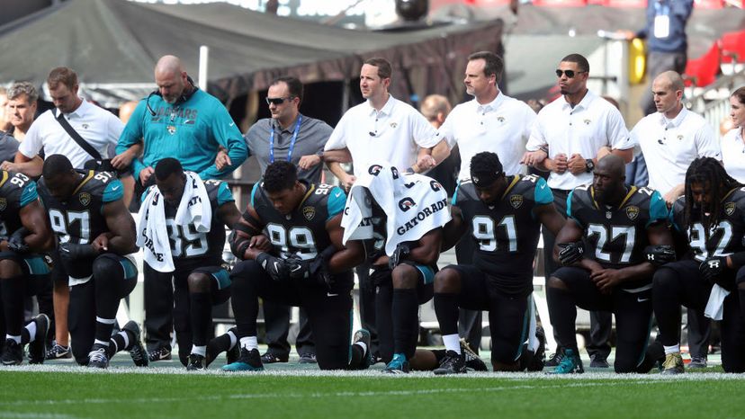 Jacksonville Jaguars players kneel in protest during the national anthem before the NFL International Series match at Wembley Stadium, London. Simon Cooper/PA Images via Getty Images