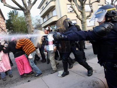 A French riot policeman uses pepper spray against protestors during the NATO summit on April 4, 2009, in Strasbourg, France.