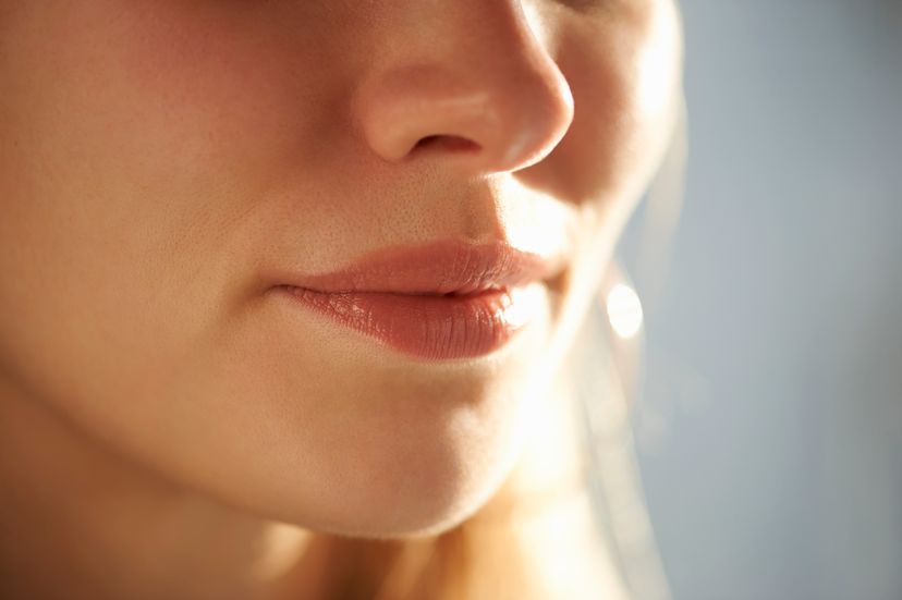 A female face close up focused on the mouth and nose.