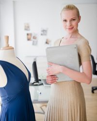 Woman in fashion office. 