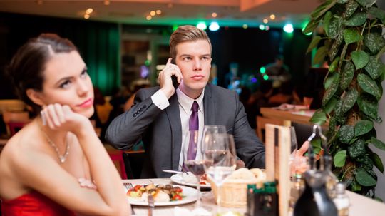 Is it rude to use your phone at the table?