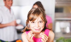 Photograph of a girl in focus with a limited depth of field.