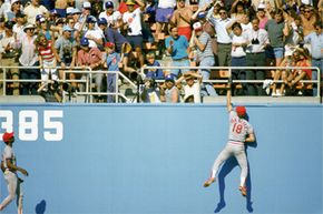 You're looking at five-time Gold Glove winner Andy Van Slyke, then playing for the St. Louis Cardinals and reaching for the catch against the Los Angeles Dodgers. Safe to say that Van Slyke knew a thing or two about the physics of fielding a ball.