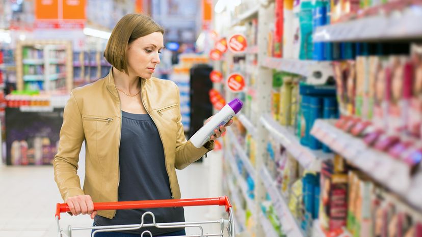 woman buying shampoo