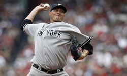 Pitcher Freddy Garcia of the New York Yankees winds up during a game against the Boston Red Sox, on July 7, 2012.