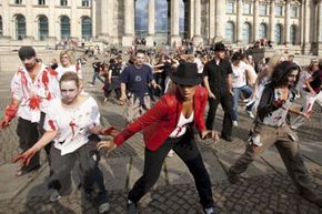 People participate in a zombie/Michael Jackson tribute flash mob in front of the Reichstag on August 29, 2009 in Berlin, Germany.