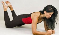 Starting position for the plank exercise, which works the entire core.