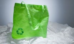 Eco bag on pile of plastic bags