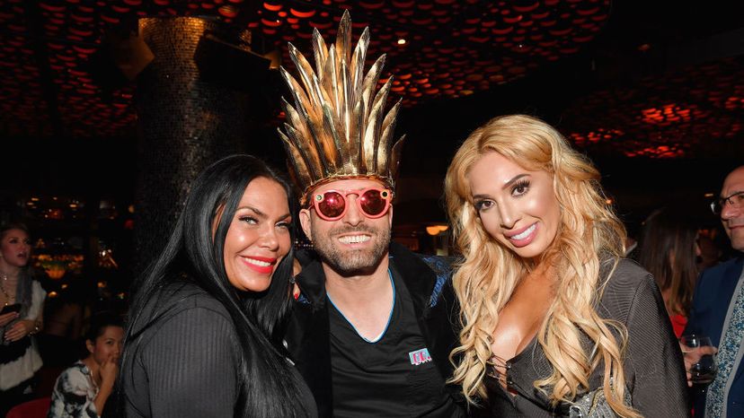 'Dr. Miami' Michael Salzhauer (standing between reality personalities Renee Graziano, left, and Farrah Abraham) attends WE tv's premiere party for the new show 'Dr. Miami' at the Tuck Room in North Miami Beach on March 30, 2017.  Salzhauer has come under fire for his outrageous plastic surgery Snapchat videos, but they also helped him land a reality TV show. Rodrigo Varela/Getty Images for WE tv/Getty Images