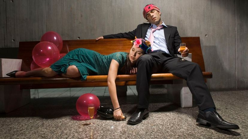 Exhausted drunk couple passed out from partying