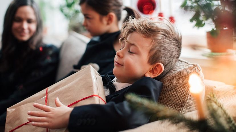 Little boy holding Christmas Gift