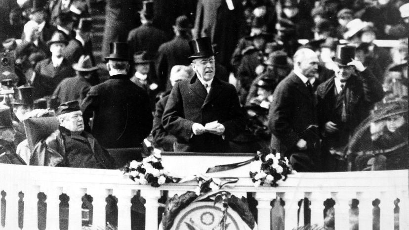 President Wilson, with top hat and speech in hand