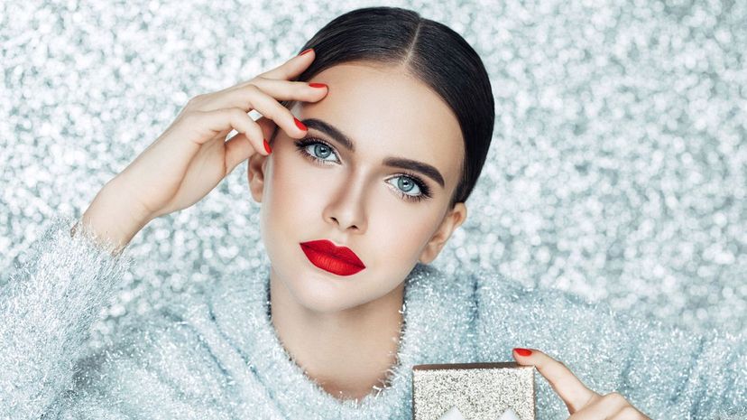 Young woman holding gift box