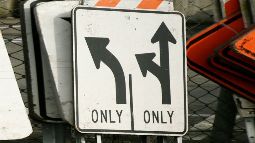 The left lane has to turn, the right lane can go straight or turn