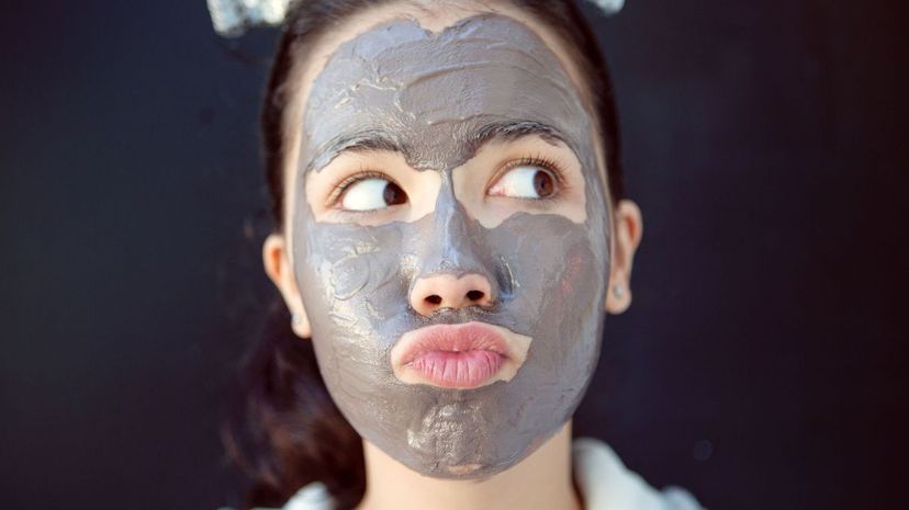 Teen with chocolate facial beauty mask