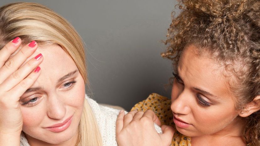 Woman consoling friend