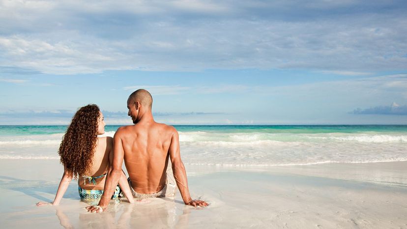 Couple cuddle at beach