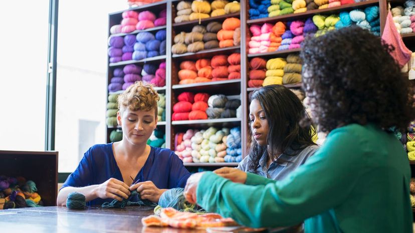 Women knitting in yarn store