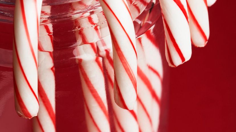 Candy canes in glass jar