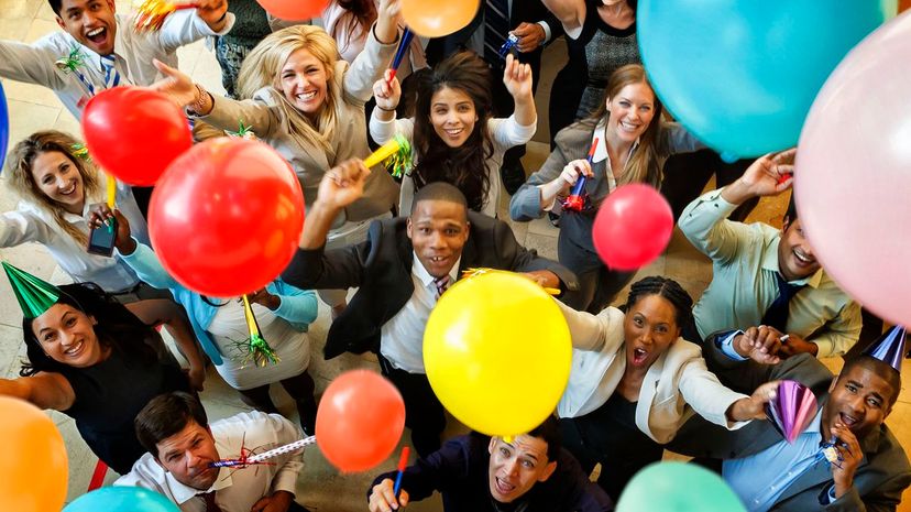 Party with balloons, hats and horns