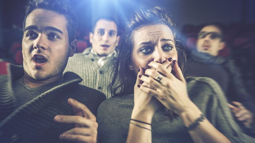 Scared couple in cinema