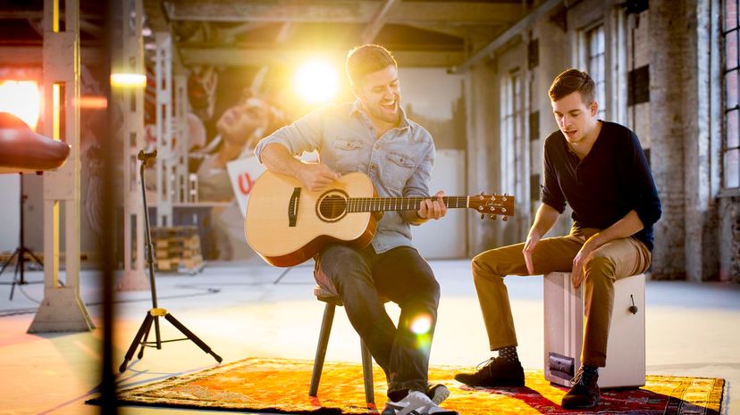 14 - men singing guitars