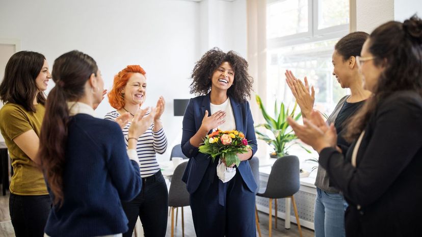 Businesswomen celebrating an achievement of a colleague