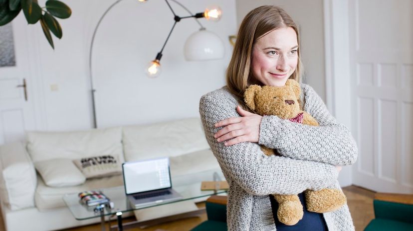 Woman Cuddling Teddy Bear