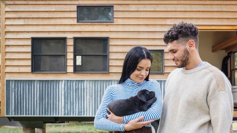 Couple holding puppy