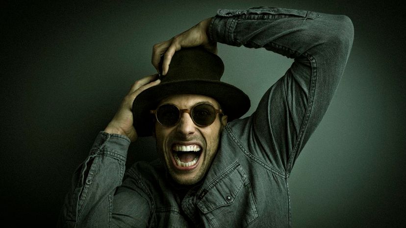 Cool and crazy man with hat and mirrored sunglasses