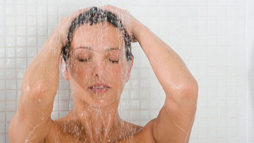 Woman showering to calm down