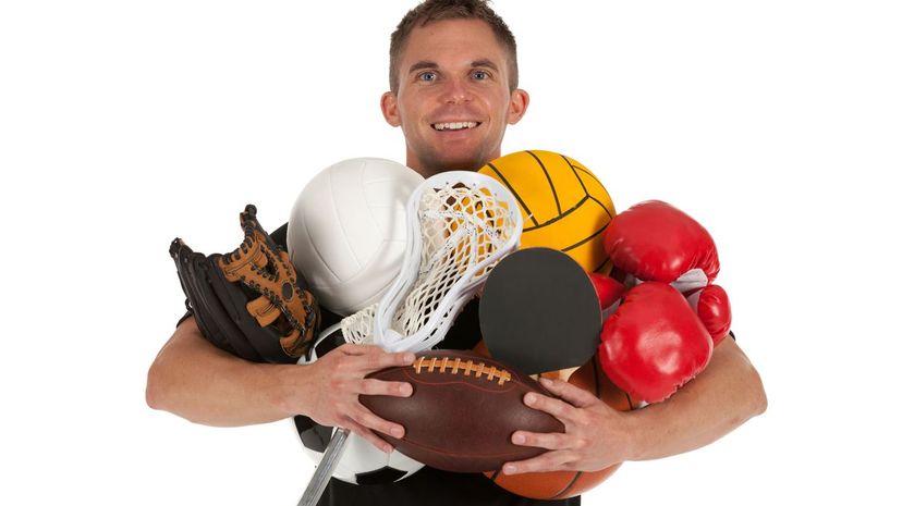 Man holding sports equiments