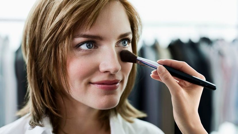 Woman putting makeup