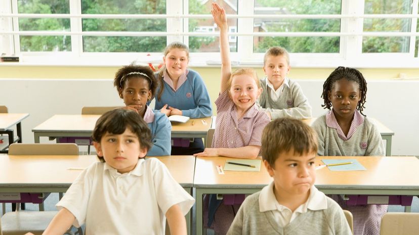 Girl raising hand in class
