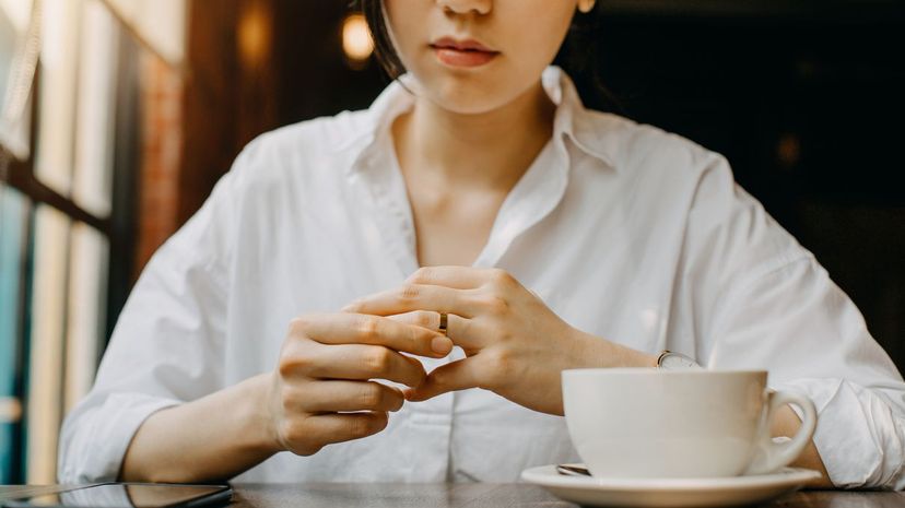 Woman Remove Wedding Band