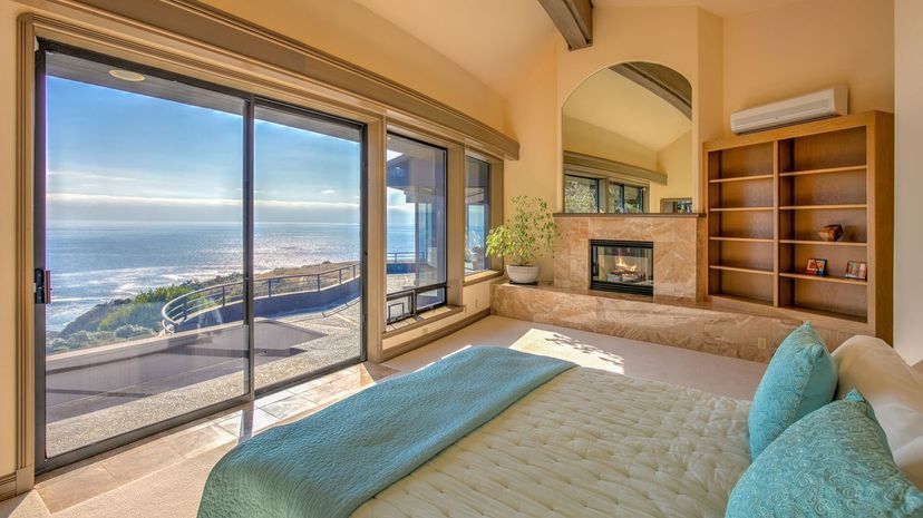 Modern, luxurious bedroom by ocean