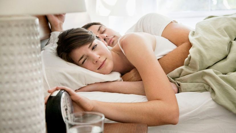 Spooning couple wake up