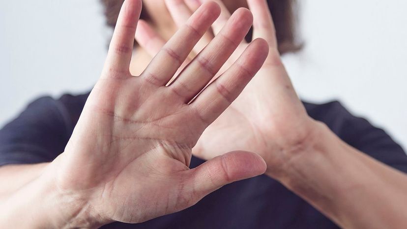 Woman making a self defense gesture