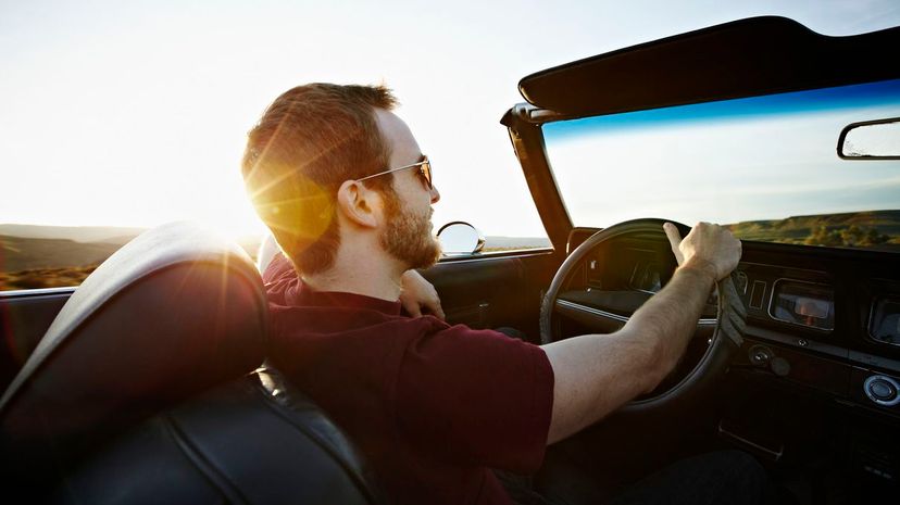 Man driving convertible