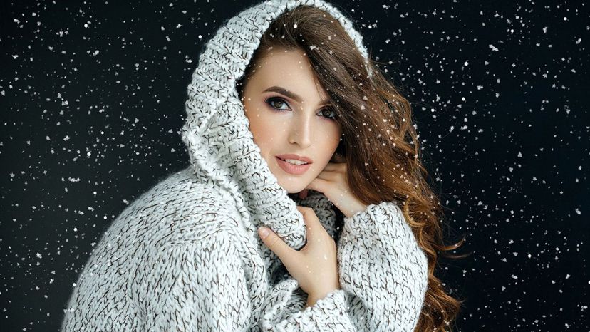 attractive woman in sweater snow brown hair