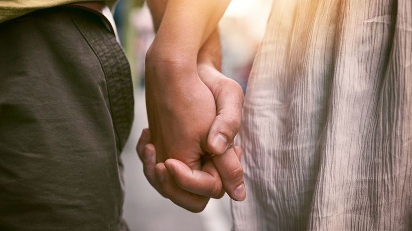 Couple holding hands