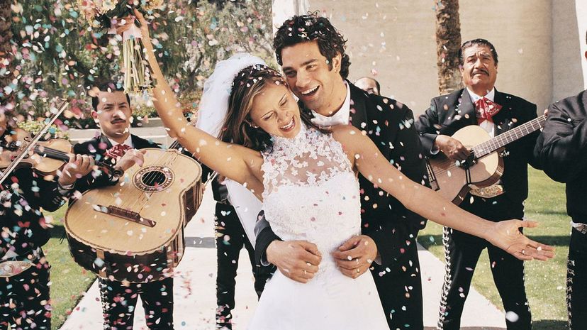 Bride and Groom Celebrating With Confetti and a Mariachi Band