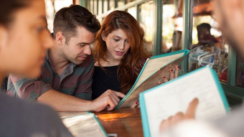 Couple looking at restaurant menu