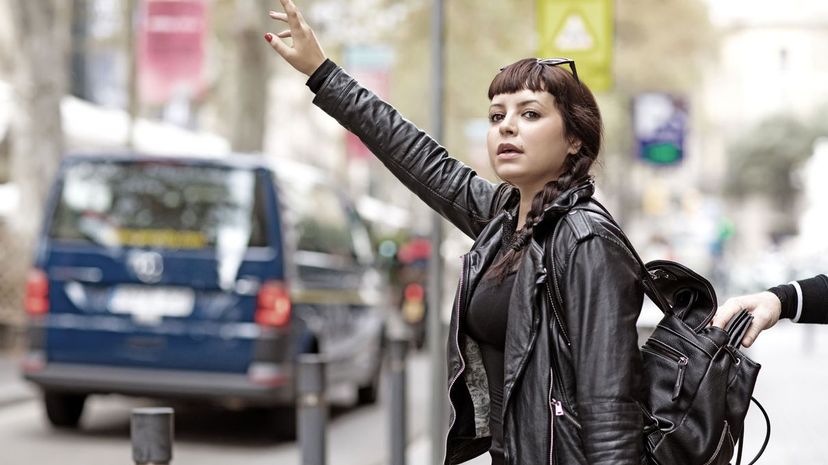 Distracted brunette female tourist and a pickpocket