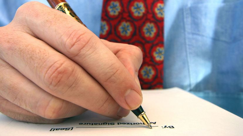 Man signing an agreement
