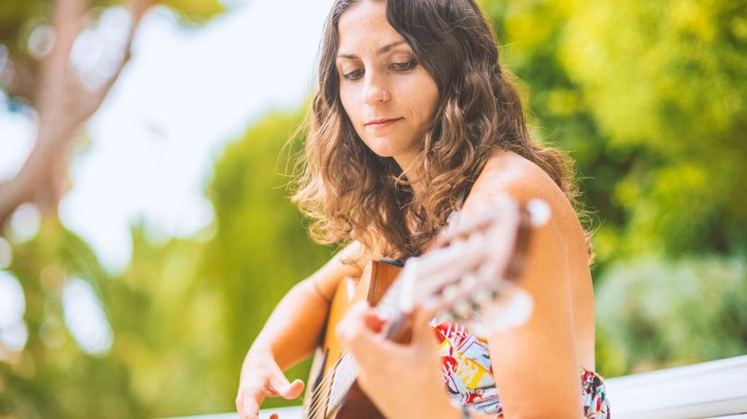 Woman playing guitar