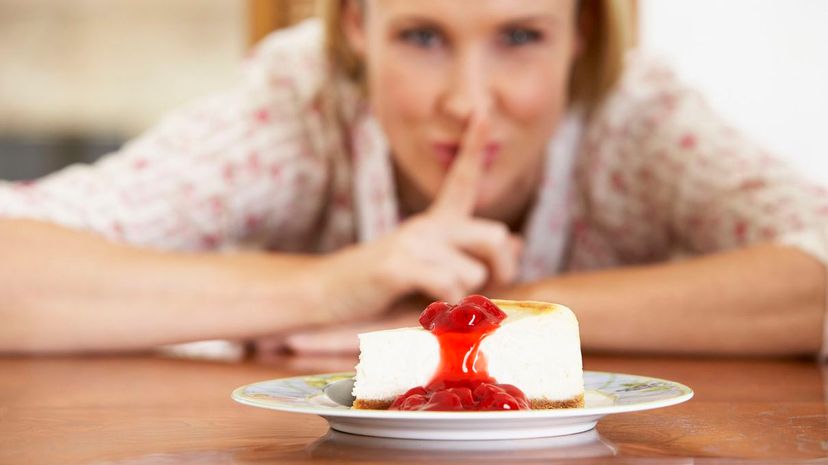 Woman Looking At Cheesecake