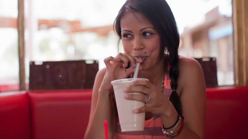 Woman drinking milkshakes