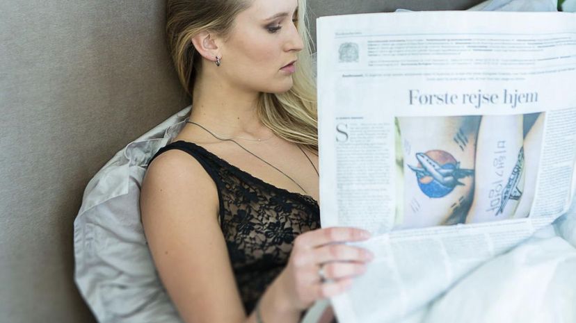 Woman read Danish paper